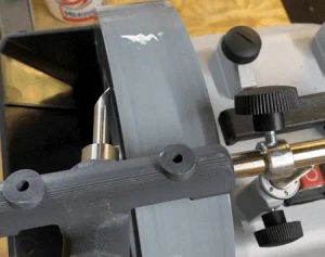 A piece of steel tube held against a grinding wheel